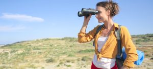 A girl looking through binoculars