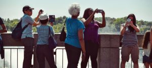 Tourists taking photos while moving to Boulder City